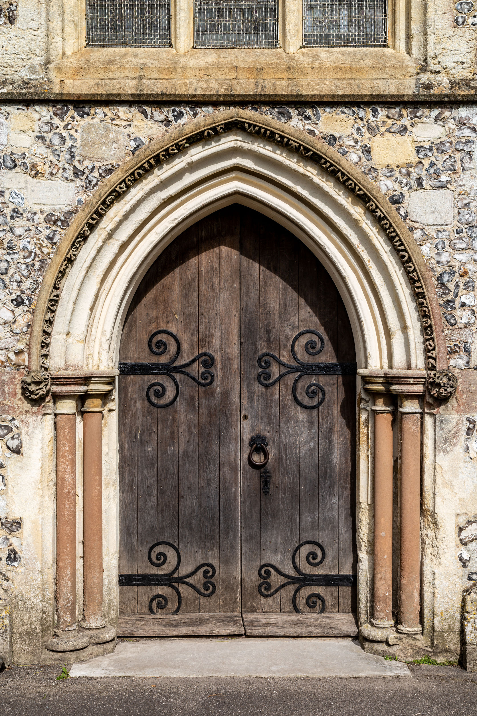 Old wooden doors at the entrance to an old english church